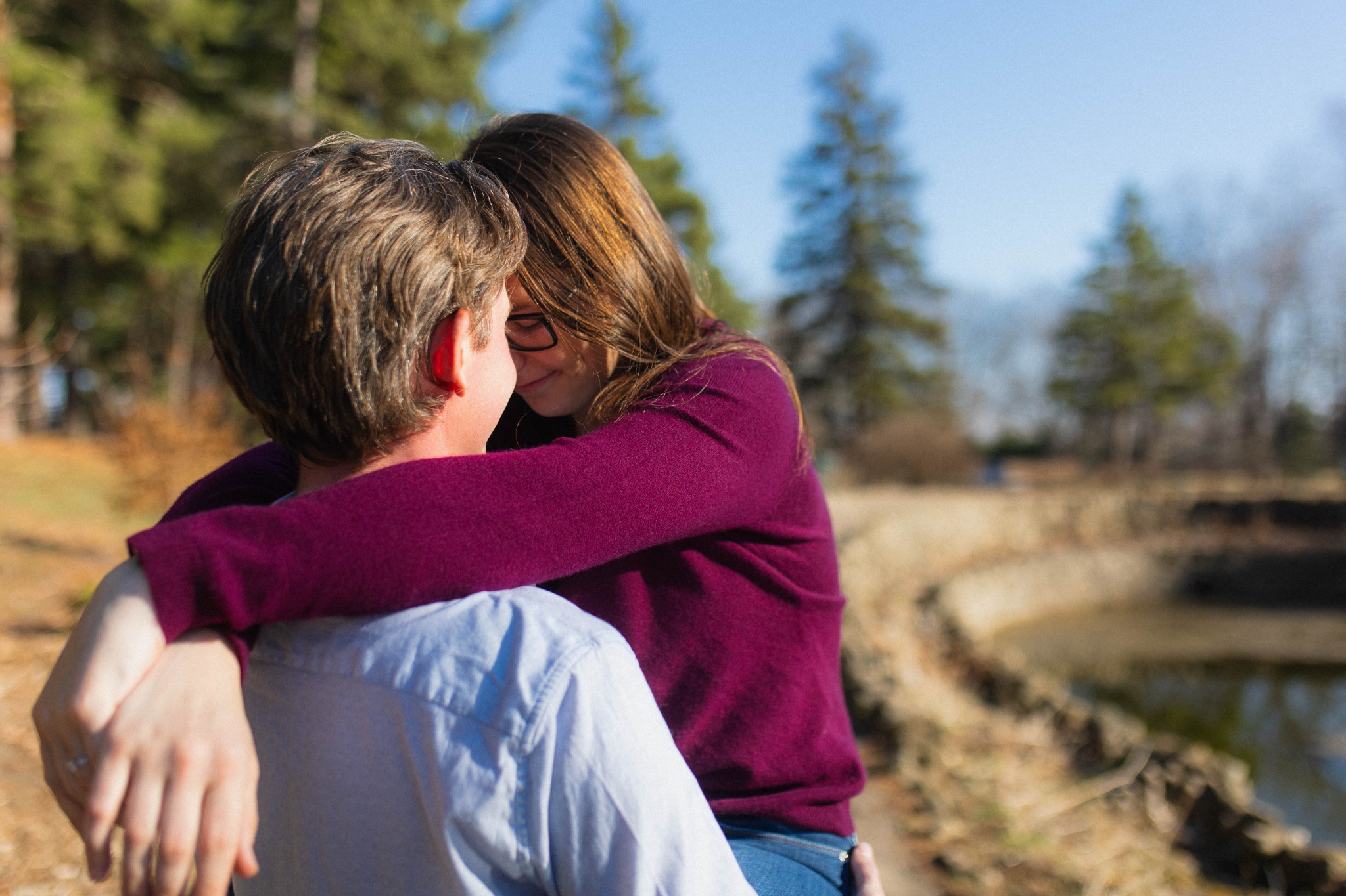 James and Rebecca hugging near water